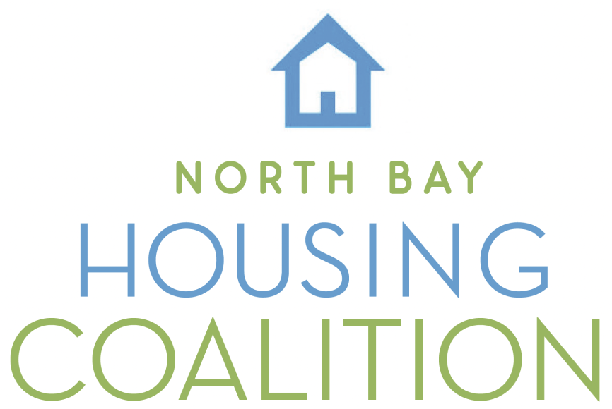 Logo of north bay housing coalition featuring a house icon within a blue upward arrow.